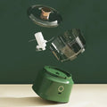 The mini electric meat grinder mincer machine in green, showcasing its 4 part assembly.