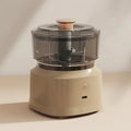 The mini electric meat grinder mincer machine in brown.