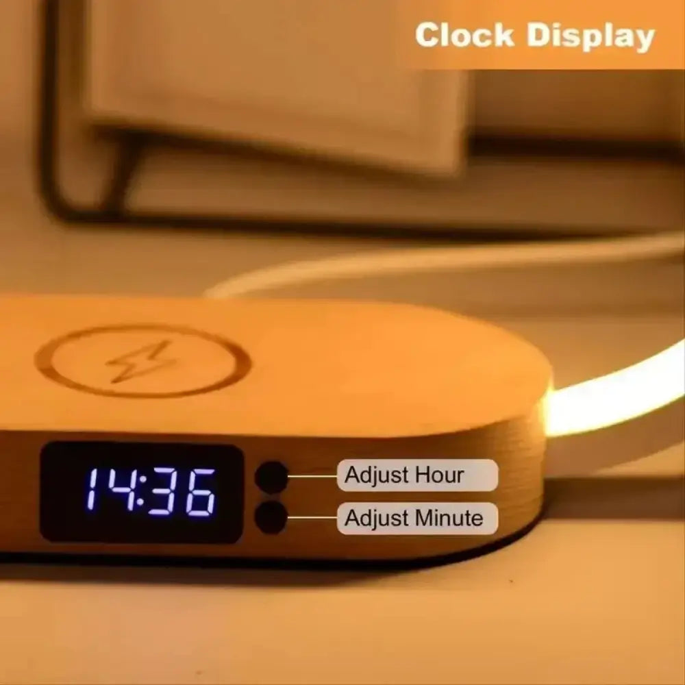 A close up of the wireless charger night light and its adjustable hour and minute dials.