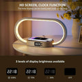 The wireless charger night light charging a phone and also displaying its 3 levels of brightness display for its clock function.